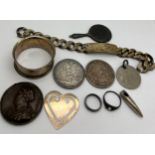 A miscellany to include identity bracelet, hallmarked silver napkin ring, silver hand mirror