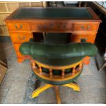 A reproduction desk and swivel captains chair with leather button upholstery. 221 w x 60.5 d x 76.