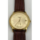 A gentleman's Longines stainless steel wristwatch, with a champagne dial, raised batons, date