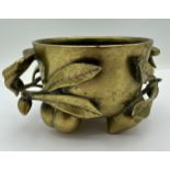 A Chinese bronze peaches incense burner with six character mark to base. 9 cm h x 11 d.