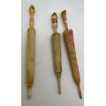Three bone needle case in the form of parasols, all with Stanhopes.