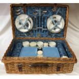 A vintage Brexton picnic hamper in original basket.