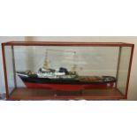 A 1:100 scale model of a Zwarte Zee ship in wood and glass display case.