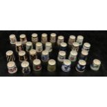 A collection of ceramic thimbles to include 15x Royal Crown Derby all with certificates, a pair of