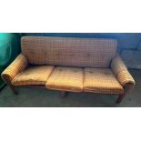 A mid century teak upholstered 3 seater sofa with additional leg to centre front 185w x 92d x 79cm h