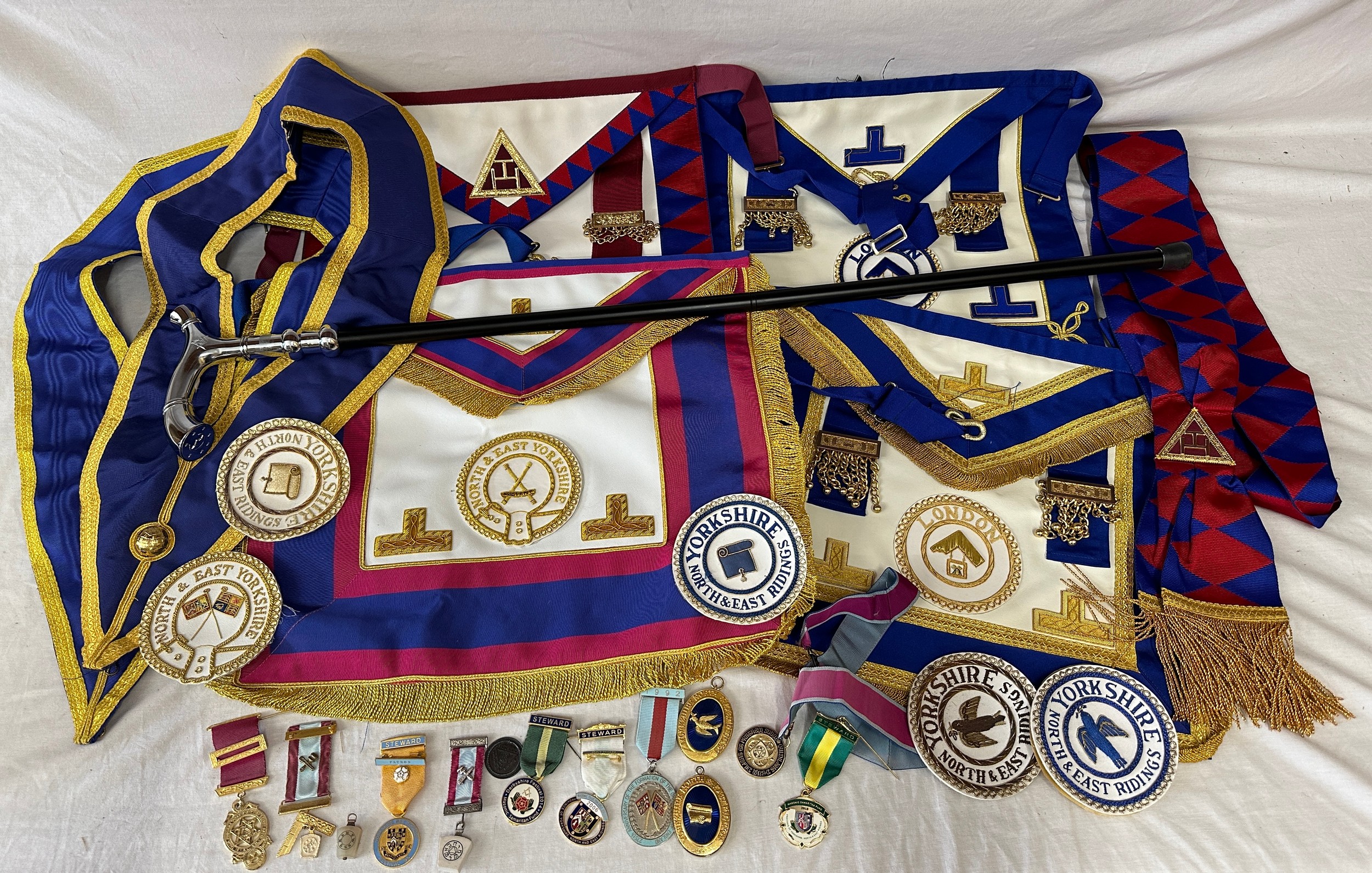 Quantity of masonic regalia to include medals, medallions, aprons, badges, sachets and walking