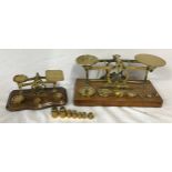 Two set of brass postal scales one by S Morden & Co along with a collection of weights.