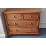 A pine chest of two short over two long drawers. 79cm h x 98 w x 50 d.