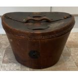 A 19thC leather top hat box and hat. 25cm h.