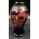 A William Moorcroft Pomegranate patterned vase signed to base 24cm h.