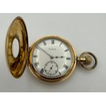 A gold-plated cased half-hunter Elgin pocket watch with white enamel face, roman numerals and