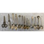 A collection of silver items to include a mother of peal handled and silver bladed pen knife