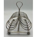 Silver toast rack Birmingham 1810, maker Matthew Boulton, weight 270gm, 15 x11cm.