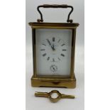 A Matthew Norman brass carriage clock with key. 13.5cm h without handle.