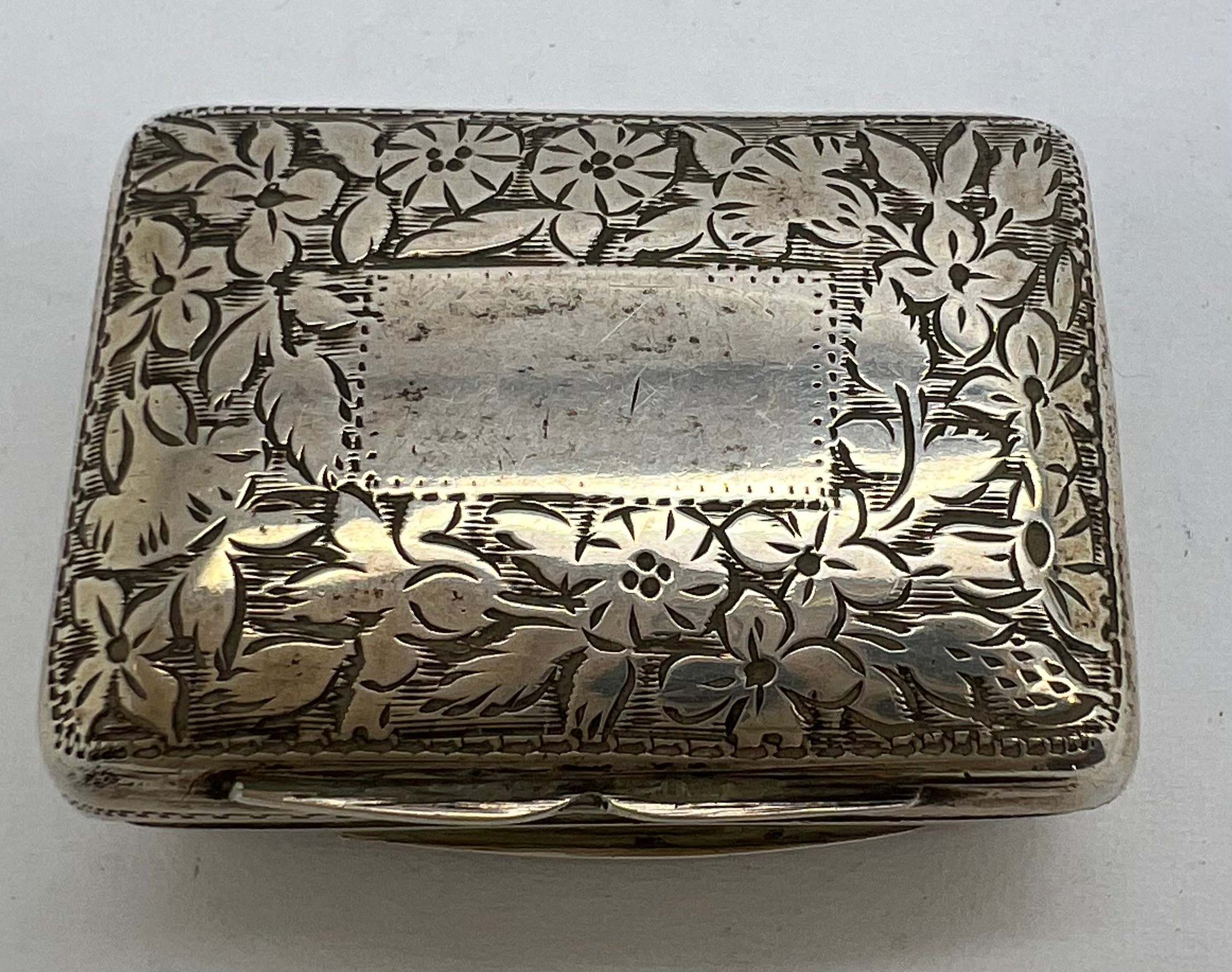 Silver vinaigrette with floral engraving, pierced silver gilt grill and vacant cartouche