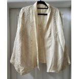 A cream vintage silk embroidered jacket with hand stitched wisteria decoration. Shoulder to hem 65cm