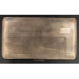 A silver cigarette case hallmarked Birmingham 1953 Harman Brothers with vacant cartouche to top,