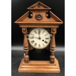 An oak mantle clock by J Unghans face with roman numerals