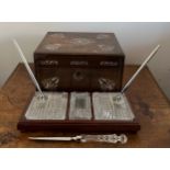 A 19thC rosewood and mother of pearl inlaid box together with a Waterford Crystal desk set with