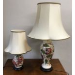Two matching Moorcroft table lamps with pink flower design tallest to top of shade 75cm.