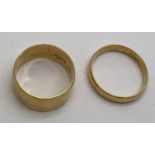 Two 18 carat gold wedding bands, total weight 13.09. Sizes U and V.