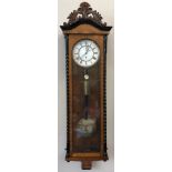 Burr walnut Vienna style wall clock with barley twist decoration to sides, circular enamel dial