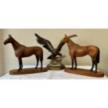Two Beswick Arkle champion steeplechaser horses on stands one with plaque tallest with base 30h