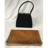 A 1940s 'Genuine Corde Product' lady's black handbag with metal clasp and green satin interior