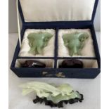 A pair of jade vases on wooden stands in original fitted box together with a figure of two birds