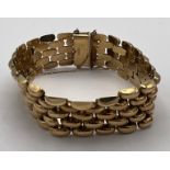 A 9 carat gold bracelet with safety chain. Weight 35.2gm.