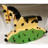 A small child's hand painted rocking horse.