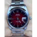A Rolex Oysterdate Precision stainless steel wristwatch with red fading face, on Rolex stainless