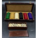 A complete boxed set of bone dominoes along with a boxed set of poker chips comprising of 34