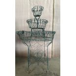 A vintage wire work plant display stand with three tiers. 109cm h x 66cm w.