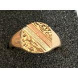 A 9 carat gold signet ring with two tone gold decoration to top. Size O/P, weight 4.2gm.