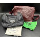 Genuine Prada handbag in vintage black leather together with an Emmy burgundy soft leather crossbody