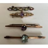 Four various gem set bar brooches to include two 9ct, one silver and one in yellow metal.