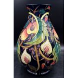 A large Moorcroft pottery vase designed by Emma Bossons in the ‘Queen’s Choice’ pattern. Tube-