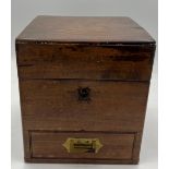 A 19thC mahogany medicine chest, complete with bottles, scales, weights, glass pestle and mortar