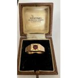 A 9 carat gold ring set with single garnet. Weight 5gm, size P.