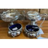Silver to include a pair of salts with blue glass liners and one spoon and two bowls on stems. Total