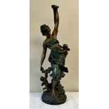 A heavy metal female figure with cherubs, 84cm h.