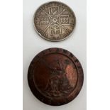 An 1890 Victoria Double Florin and a 1797 Cartwheel twopence coin.