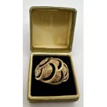 A 9 carat gold ring in decorative open work. Weight 4.1gm. Size T.