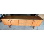 A mid century Mcintosh and co ltd sideboard with 3 central burr wood drawers planked by 2 cupboard