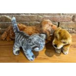Three Steiff soft toys, two dogs and a cat, two with buttons, all with labels.