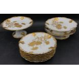 A French white and gold gilt dessert service to include 2x heightened desert plate, cake stand and