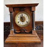 An oak cased mantle clock by Fattorini & Sons, Bradford with white enamel face. Key and pendulum