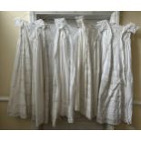 Five late 19thC/ 20thC christening gowns with panelled broderie anglaise together with an