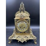 An ornate brass mantle clock 39cm h.